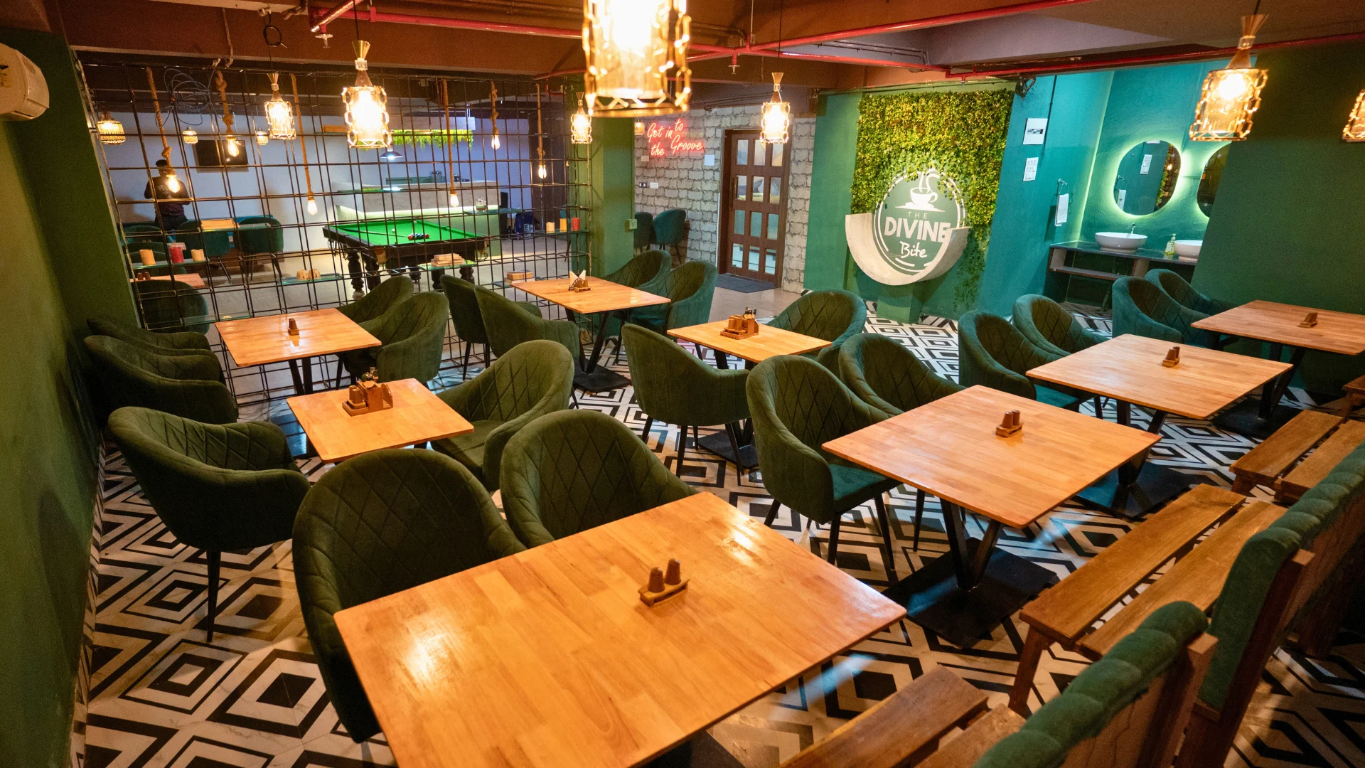 The Divine Bite dining room at Hotel Shubham Grand