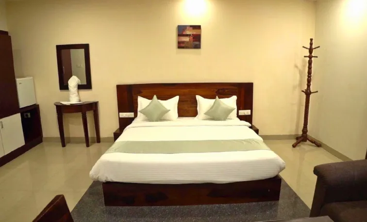 Deluxe room interior at Hotel Shubham Grand, Patia